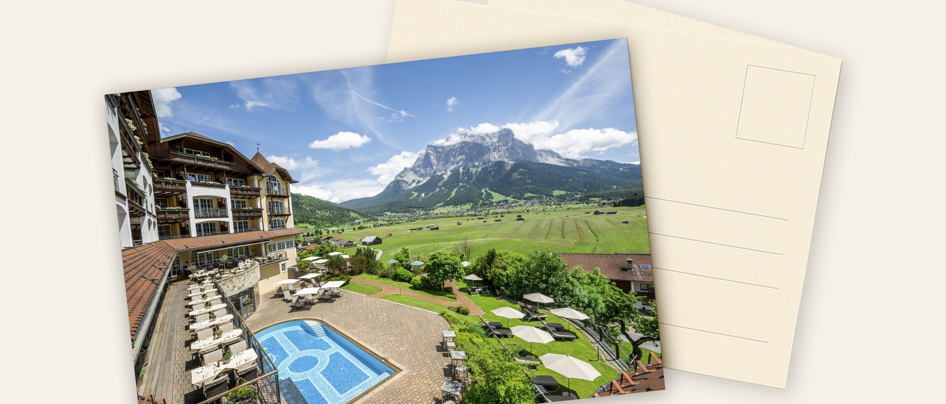 Postcard-style mountain panorama with hotel resort – a picture-perfect getaway.