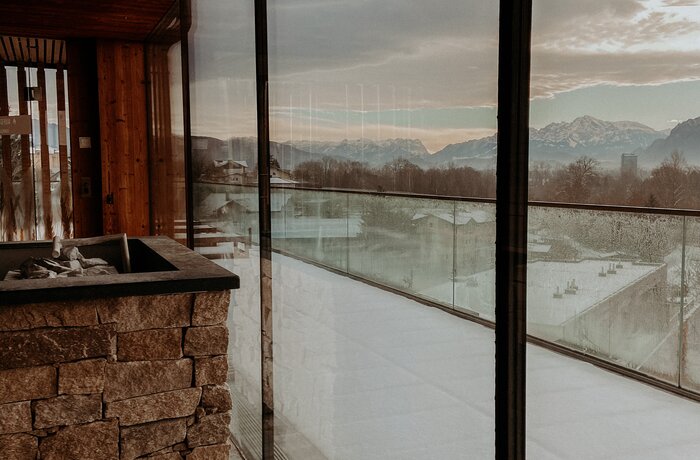 Interior with view of snow-capped mountains through large windows