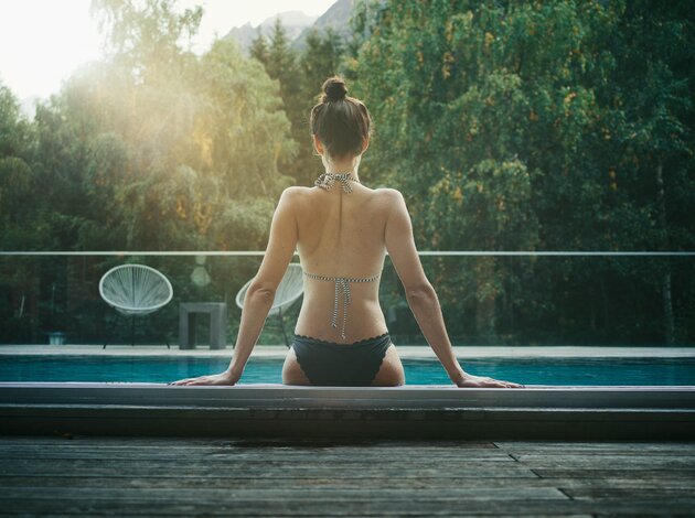 Swimming in the Outdoor Pool | Best Alpine Wellnesshotel Waldklause, Längenfeld