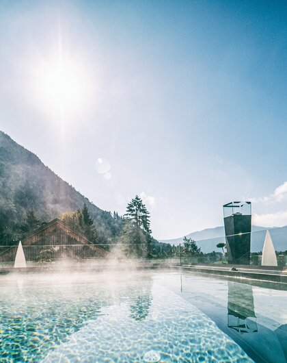 Roof Pool in the Morning Sun | Best Alpine Wellnesshotel at the Achensee, Alpenrose