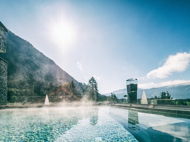 Roof Pool in the Morning Sun | Best Alpine Wellnesshotel at the Achensee, Alpenrose