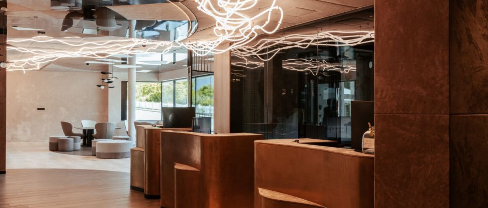 Lobby with reception desk and abstract ceiling lighting