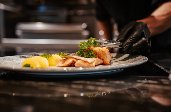 Freshly prepared gourmet dish served with attention to detail in an elegant culinary setting.