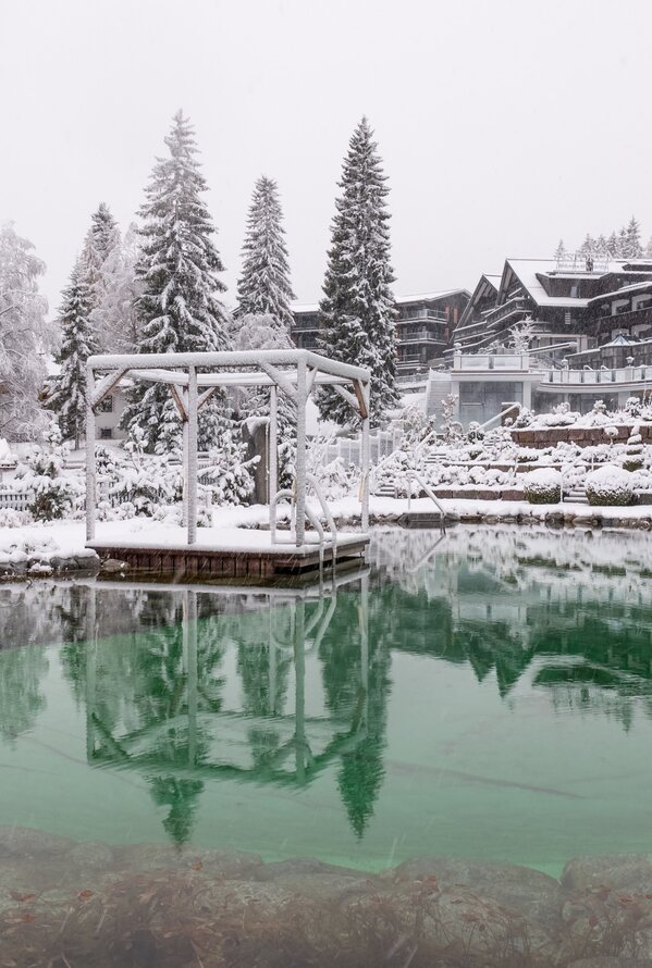 Snow-covered swimming lake in winter| Alpin Resort Sacher, Seefeld