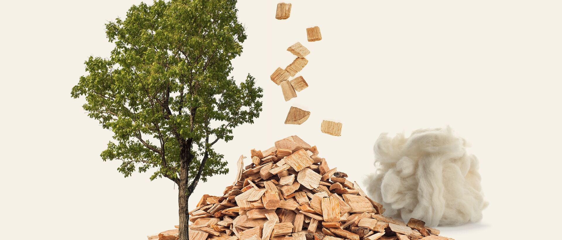 Tree, wood chips, and natural fibers symbolizing sustainable raw materials.