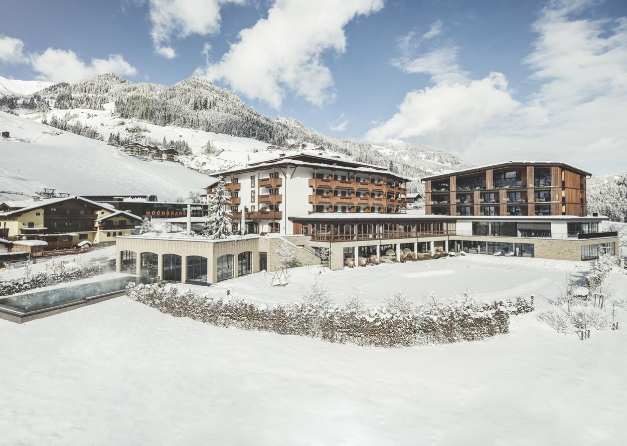 Hotel in verschneiter Winterlandschaft | 4 Sterne Superior Wellnesshotel Nesslerhof, Wellnesshotel Salzburger Land