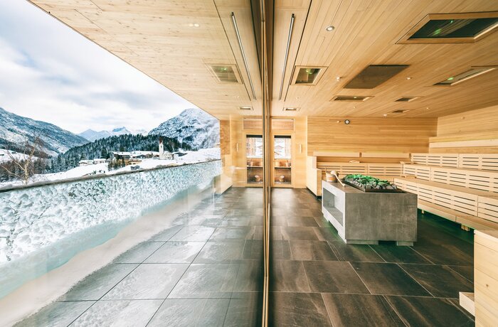 Interior view of a wellness area with a view of snow-capped mountains