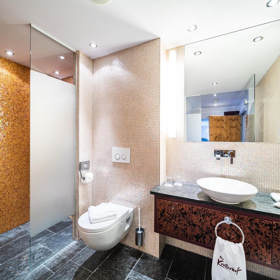 Modern bathroom with shower, toilet and sink