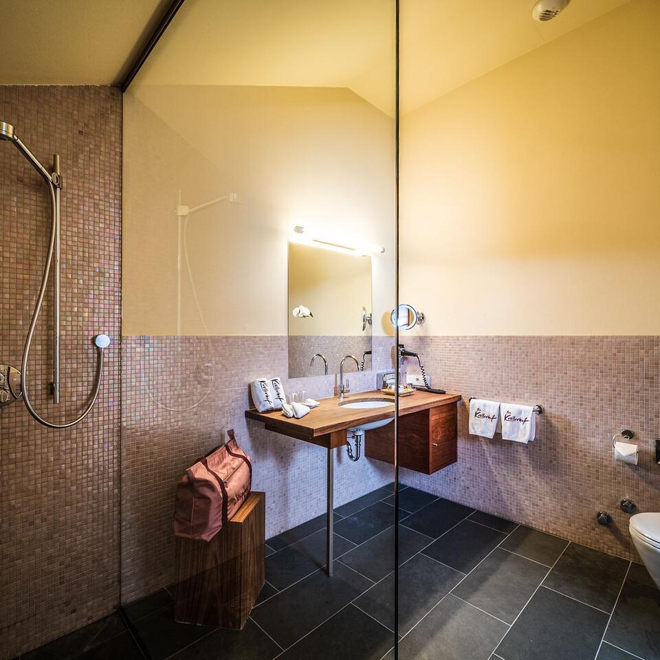 Modern bathroom with shower, sink and mirror