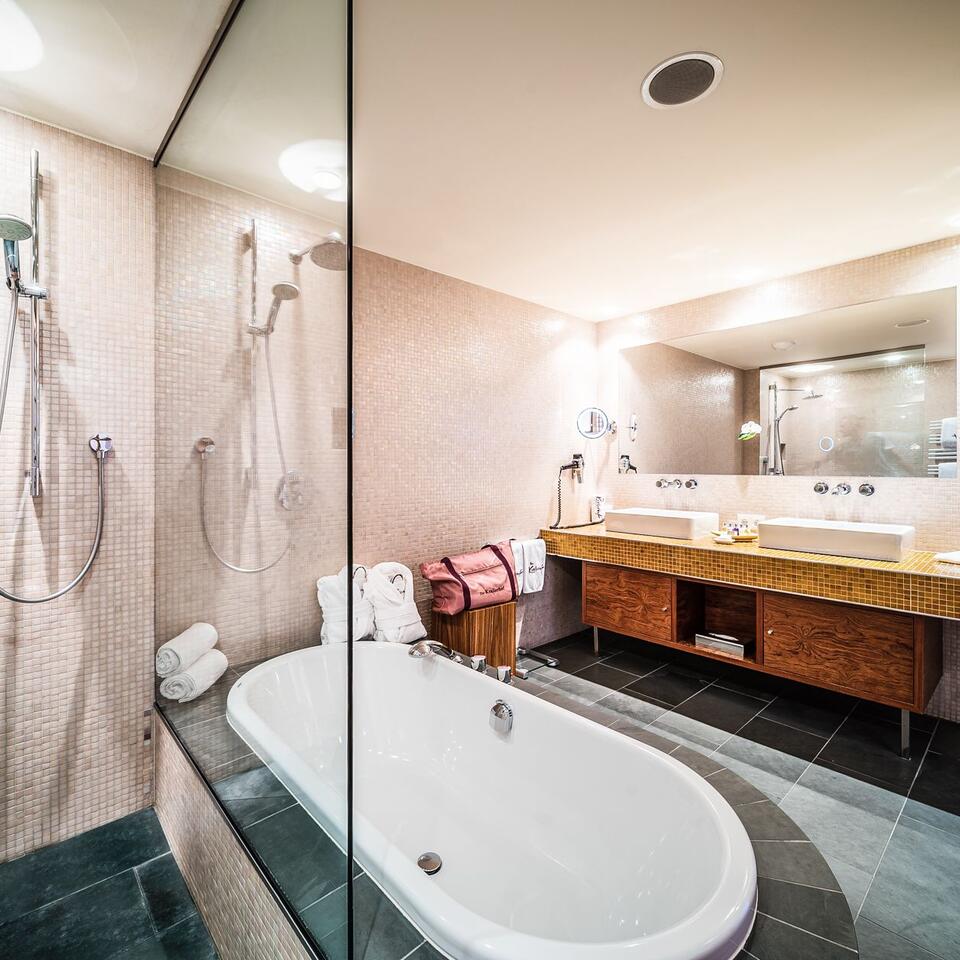 Modern bathroom with bathtub, shower and double vanity